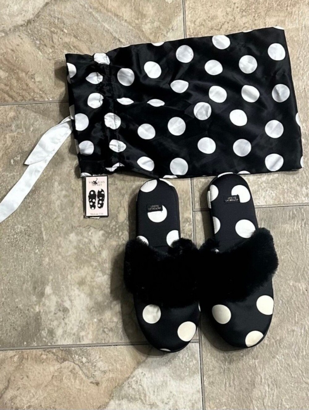 Victoria's Secret Black and White Polka Dot Slippers are a size Medium.